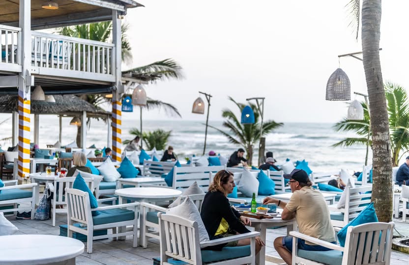 The DeckHouse main deck on a sunny day overlooking An Bang Beach in Hoi An, Vietnam, just steps from Shore Club.